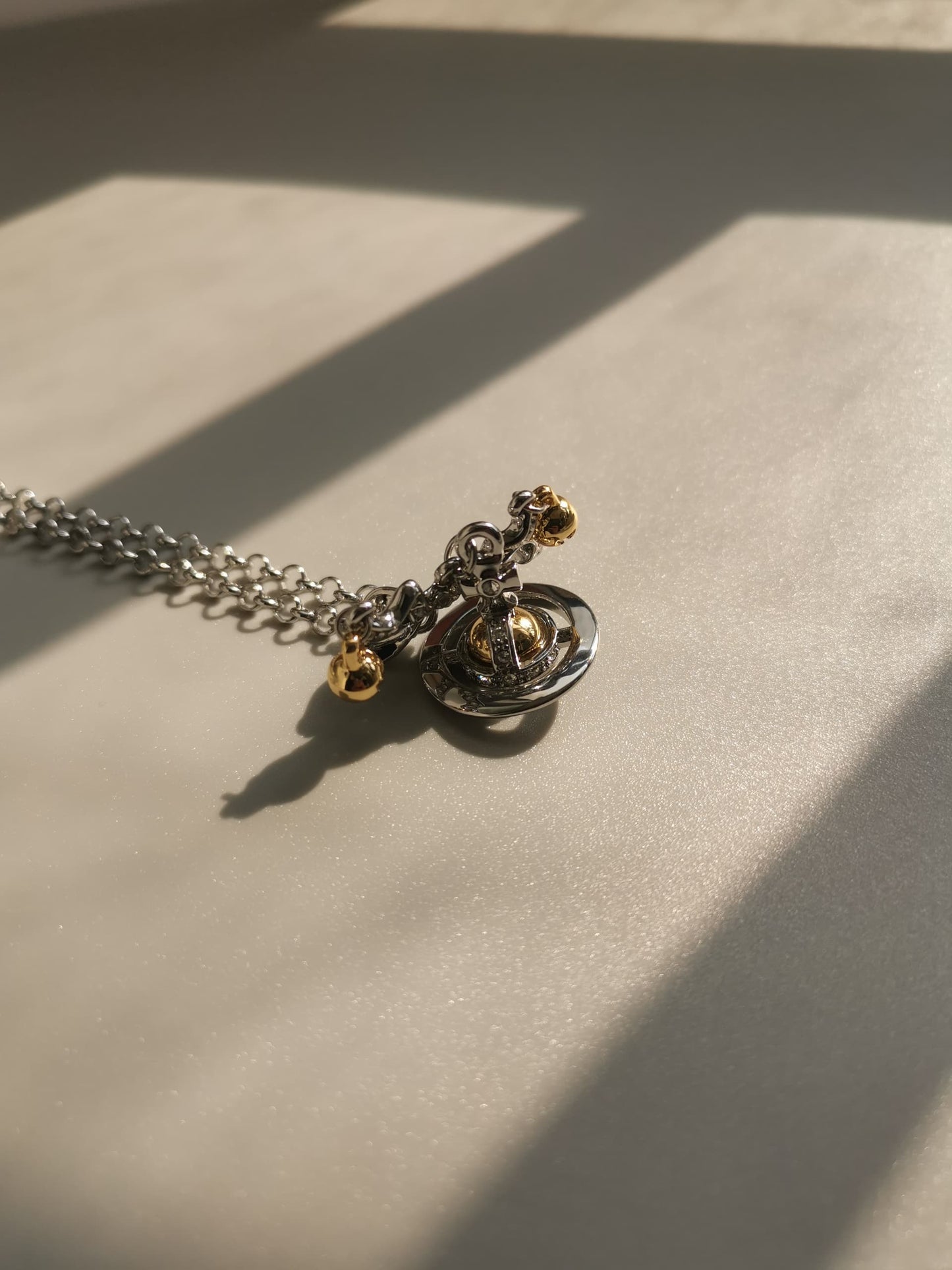 Silver and gold bow orb necklace (with box)